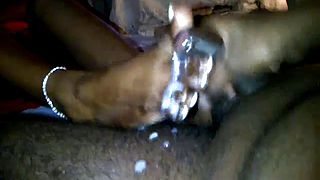 I love it when my ebony babe gives me footjobs so i made a movie where i cum all over her arousing black feet