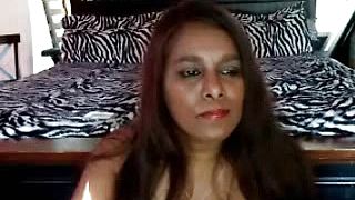 A hot Indian lady striping on webcam